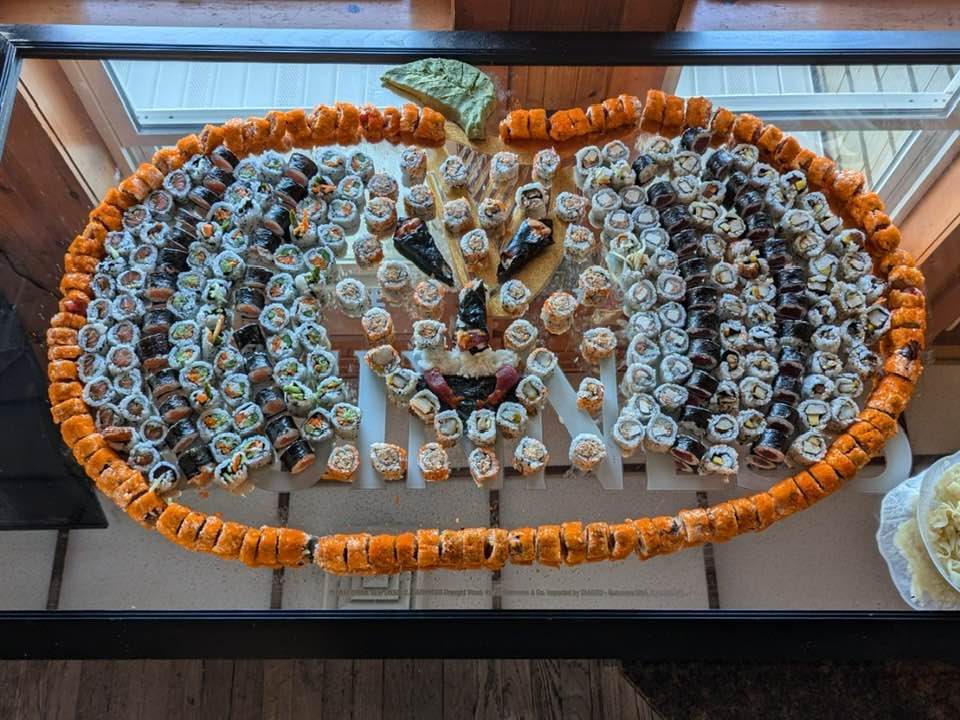Sushi tray by the window overlooking the water
